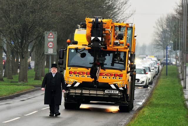A Horizon crane leads the cortege for Carronshore driving instructor Mary Reid