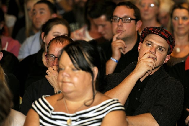 Audience listen intently.