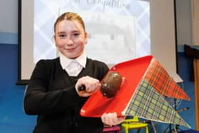 A proud youngster prepares to Address the Haggis.