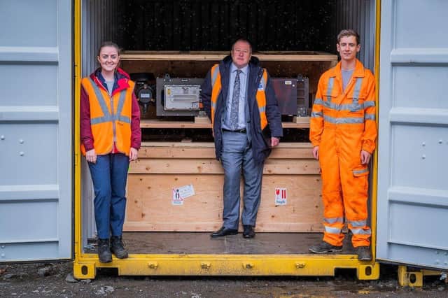 Transport Minister Dey (centre) and hydrogen train team members Emma Armstrong, Scotrail, (L) and Calum Sellar, Arcola Energy (R)