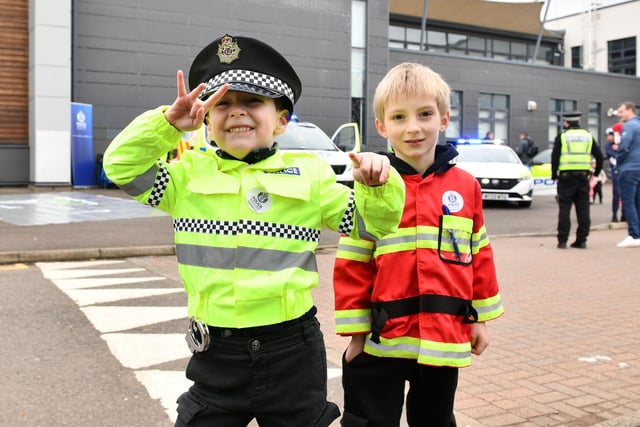 Cops and firefighters are getting younger every year - just look at five-year-old Theodore and young Noah Richardson, 5, at Saturday's open event