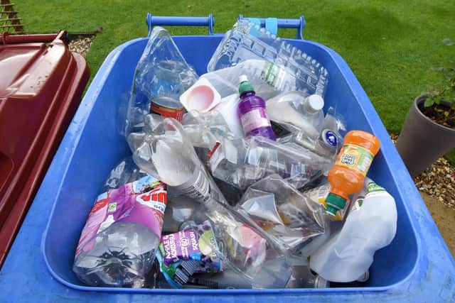 Plastic containers put in blue bins should be cleaned first or householders risk a red tag. Pic: Falkirk Council