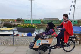 Student Andrew Byrne-King pilots new Rector Dr Leyla Hussein OBE on her 'drag' around St Andrews.