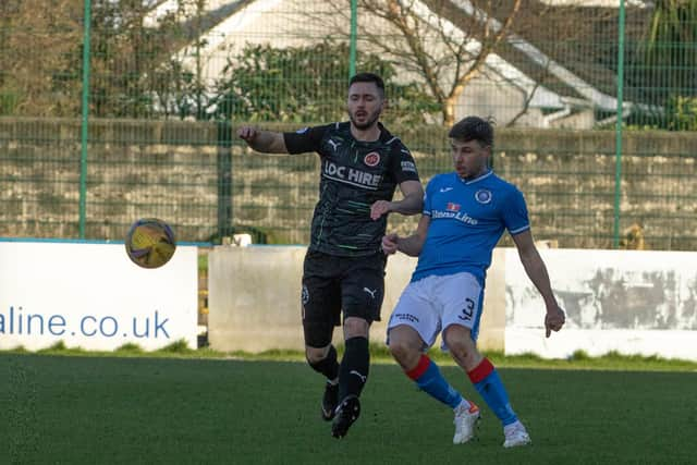 Goalscorer Thomas Orr battles for the ball in midfield