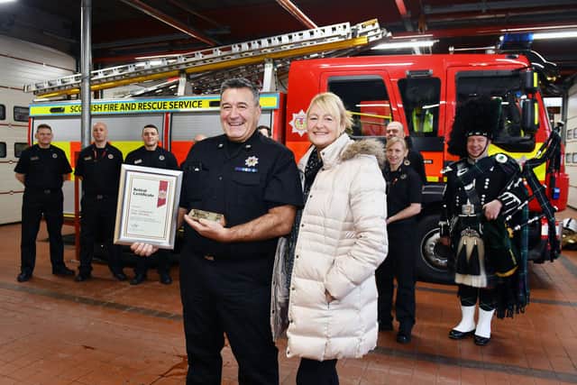 Bo'ness Fire Station holds a special retirement ceremony for 30-year blue watch firefighter Michael Sherdley, pictured with wife Jeni, piper Gordon Fisher and blue watch colleagues
