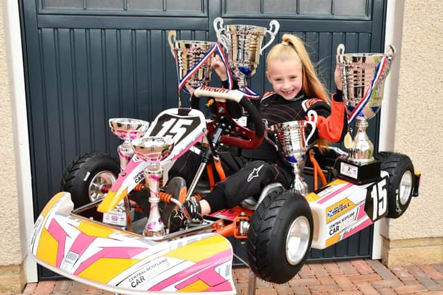Khloe McGill with her go-kart and impressive array of trophies. Pic: Michael Gillen