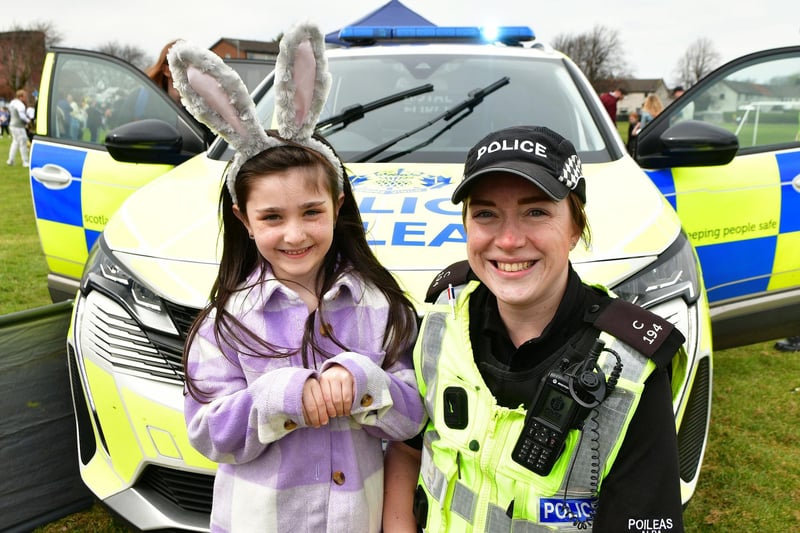 Rosie Bell, 7, meets Community PC Pacitti during the Inchyra Park Easter Egg Hunt 2023
