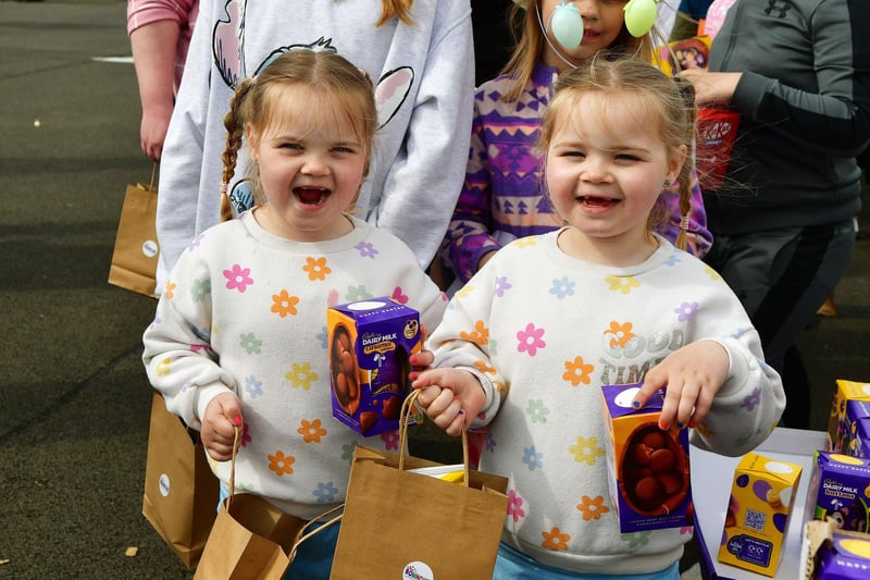 Six-year-old twins Perrie and Pyper Thornton - an appropriate surname for chocolate-themed fun - get their reward for a successful Easter egg hunt