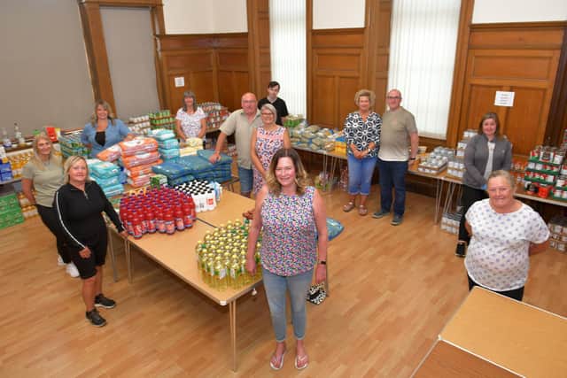 Sheona McMorran (front, centre) and fellow KLSB Community Pantry volunteers are delighted with the support they have received from Stenhousemuir FC. Picture: Michael Gillen.