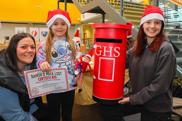 Kim with daughter Lillie and GHS pupil Millie running the postal service to Santa.