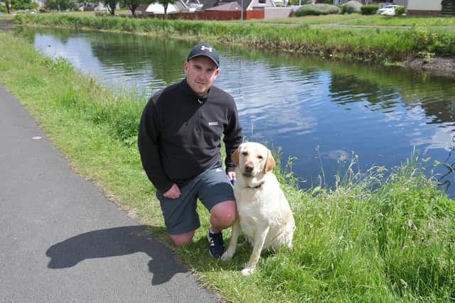 Grant Dempster was walking his dog, Bailey, when he helped to rescue a woman and two children who’d fallen into the canal in Falkirk. Picture: Michael Gillen.
