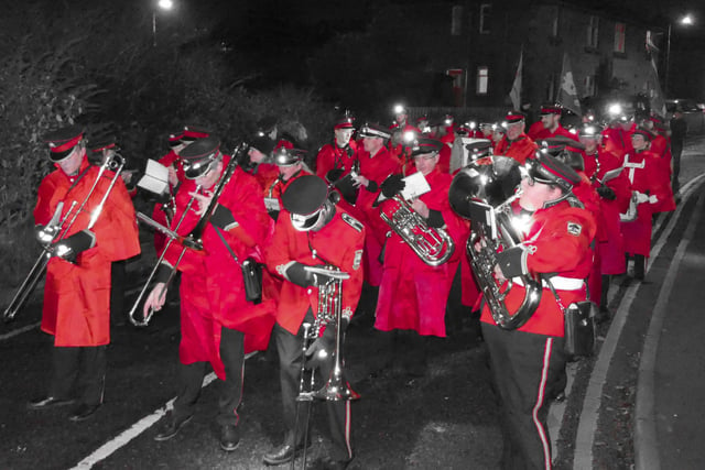 Linlithgow Reed Band members looked resplendent, as ever, in red as they prepared to lead the parade.
