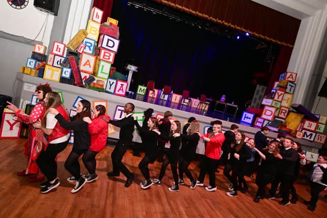 Yvonne Manning, principal librarian and founder of the event, gets the RED Book Awards 2023 underway with some lively moves round Grangemouth Town Hall