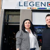 Barber Karolina Sadel joins owner Steven Kelly outside Legends in West Bridge Street(Picture: Michael Gillen, National World)