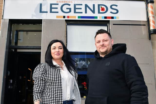 Barber Karolina Sadel joins owner Steven Kelly outside Legends in West Bridge Street(Picture: Michael Gillen, National World)