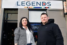 Barber Karolina Sadel joins owner Steven Kelly outside Legends in West Bridge Street(Picture: Michael Gillen, National World)