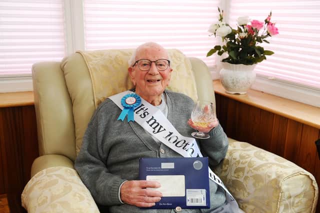 John William Boot, known as Jack, celebrates his 100th birthday with his tot of brandy - one of the secrets of his long life