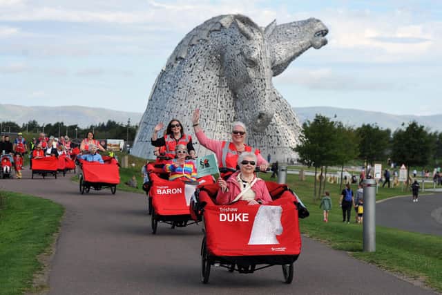 Shauna Brown, trishaw pilot, and Janet Brown, passenger, on Duke, while Pamela Smith took Fiona Bogie round Cycling Without Age Scotland's new route at The Helix. Picture: Michael Gillen.