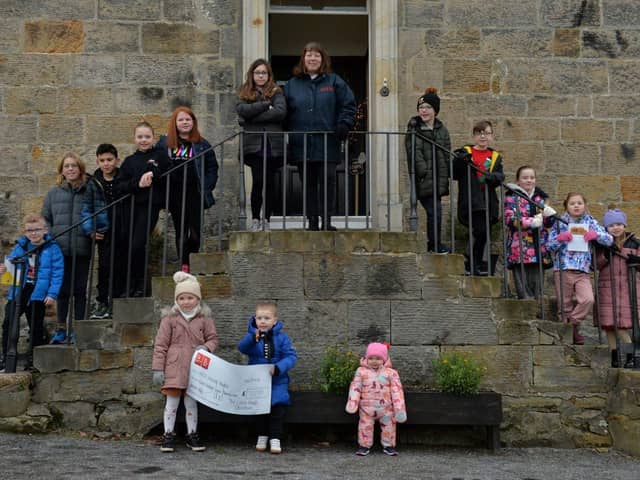 The children were delighted to hand over a cheque for £722