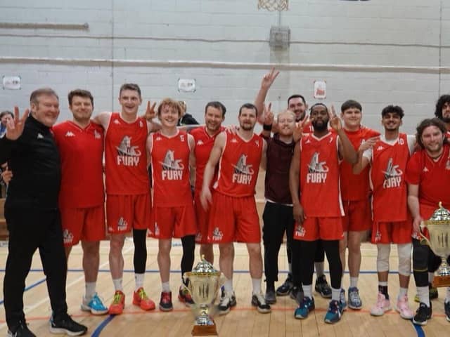 The Falkirk Fury team celebrate with the SBC trophy after securing a seventh top title at the Crags SC in Edinbrugh (Photo: Submitted)
