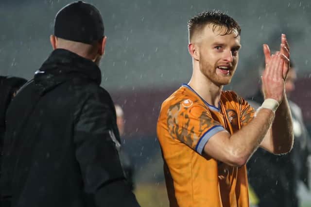 Tony Coutts applauds Shire fans after scoring winner against Celtic B