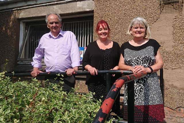 Pictured outside the hall: Harry Johnston (chair), Joanne Fox (secretary) and Joan Sutherland (treasurer).