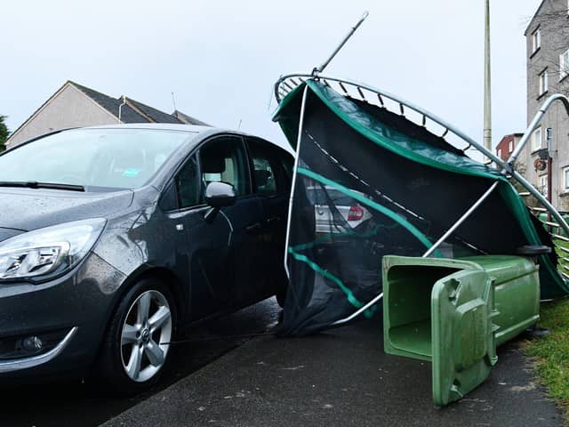 Storm Isha blows over a trampoline onto a car on Teviot Street, Bantaskine.