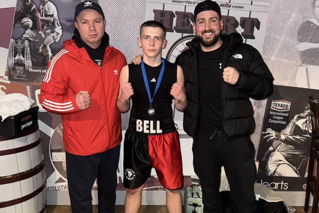 Sparta’s Evan Bell after his silver medal win at Tynecastle with coaches Vitali Cojocar and Sam McLeod (Photo: Submitted)