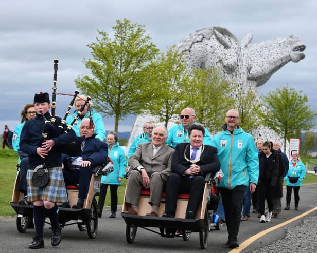 Piper Harrison Cooper, 12, led the procession for the official opening of the Cycling Without Age Scotland hub at the Helix Park.  (Pic: Michael Gillen)