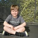 Hector Farquhar, nine, who raised over £600 for Bowel Cancer UK by bouncing on trampoline 100 times a day