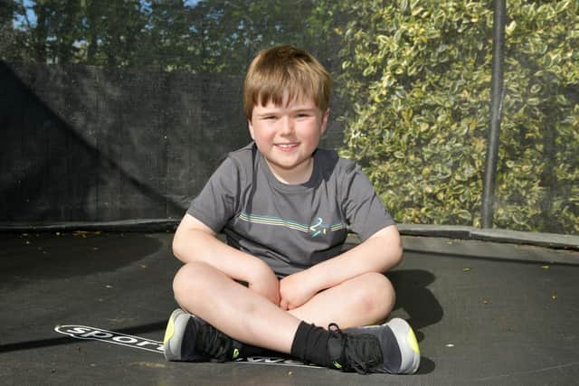 Hector Farquhar, nine, who raised over £600 for Bowel Cancer UK by bouncing on trampoline 100 times a day
