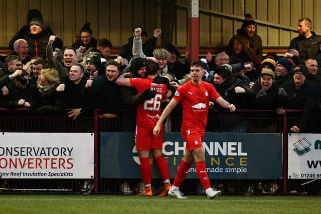 The Bairns support enjoy the moment after Burrell's strike