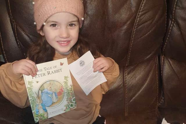 A delighted Avonbridge youngsters with her first free book. Pic: Contributed