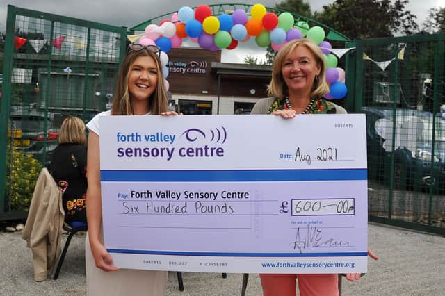 Amy McEwan pictured presenting a cheque to Jacquie Winning, Forth Valley Sensory Centre CEO.  Picture: Michael Gillen.