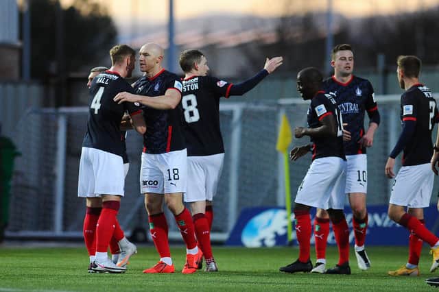 Conor Sammon is congratulated by his colleagues after putting Falkirk 2-0 up against Peterhead on Saturday at Falkirk Stadium, just a whisker away from half time (picture by Michael Gillen)
