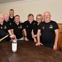 Melissa Garrity, from the Carronshore Bar smashing the bottle with Carronshore Heritage Forum and Kate Dempster, licensee looking on.   (Pic: Michael Gillen)