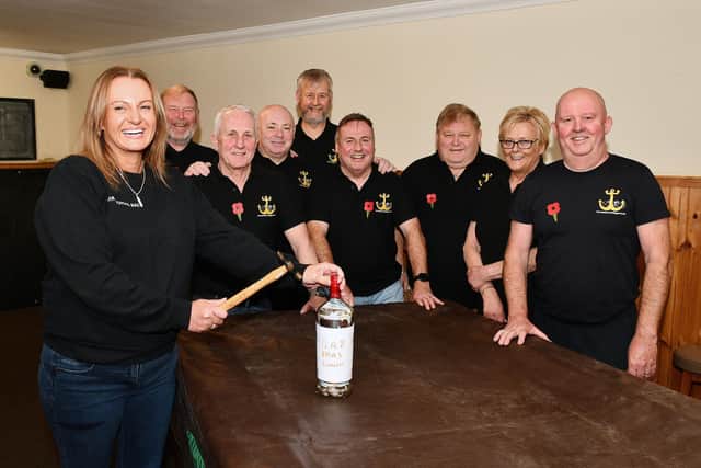 Melissa Garrity, from the Carronshore Bar smashing the bottle with Carronshore Heritage Forum and Kate Dempster, licensee looking on.   (Pic: Michael Gillen)