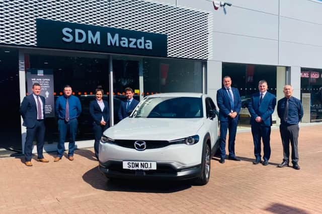 SDM Mazda wins  ‘Dealer of the Year’  - from left Steven Learmonth, Lewis Wood, Helen Aitken, Brett Hague (Mazda UK head of network strategy), Peter Alibon (Mazda UK sales director), Niall Syme and John Mallis