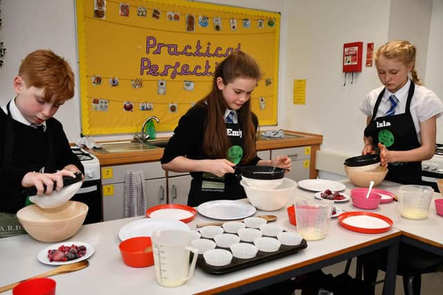 First year pupils get to grips with baking cakes