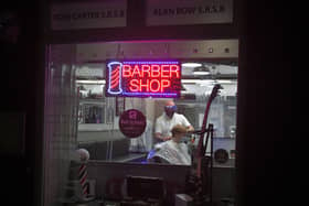 Ross Carter opened his barbers shop in Laurieston at midnight to start the first professional haircuts of lockdown easing.  Pic: Michael Gillen