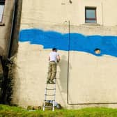 Artist Scott Gilbert has been commissioned by Strathcarron Hospice to create a mural in Denny to mark the service's 40th year. Picture: Ailsa Herd.