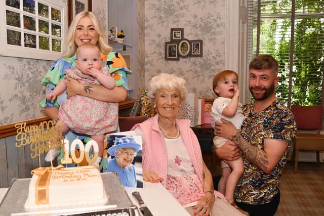 100th birthday party time for Nan Davies of Laurieston, joined by granddaughter Hayley Smith, great-granddaughter Goldie Smith, great-grandson Sonny Grant and grandson Steven Grant