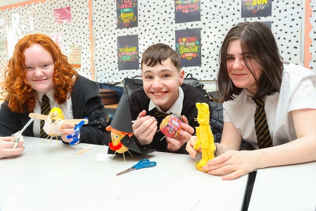 Lucy McMillan, 12, Mason Best, 12, and Faith Scott, 12, enjoy the fun of potato customisation at Graeme High School to mark World Book Day(Picture: Scott Louden, National World)