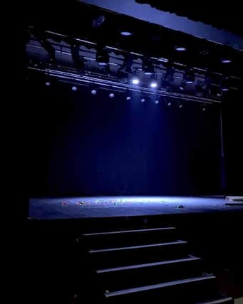 The ghost light shines down on a empty stage at Falkirk Town Hall