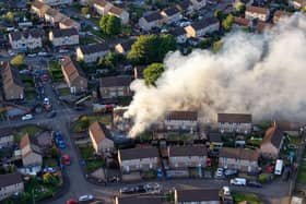 The blaze took hold in two properties in Ladeside Crescent, Stenhousemuir (Picture: Ryan Shiells)