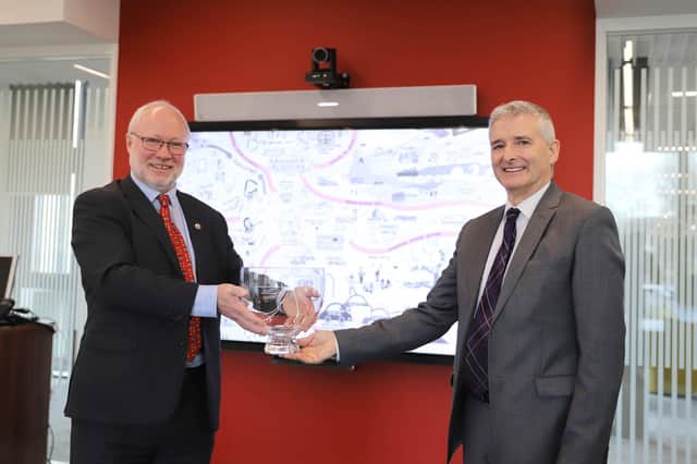 Dr Thomson receives his award from Aidan O’Carroll, who chairs the Institute of Directors Scotland