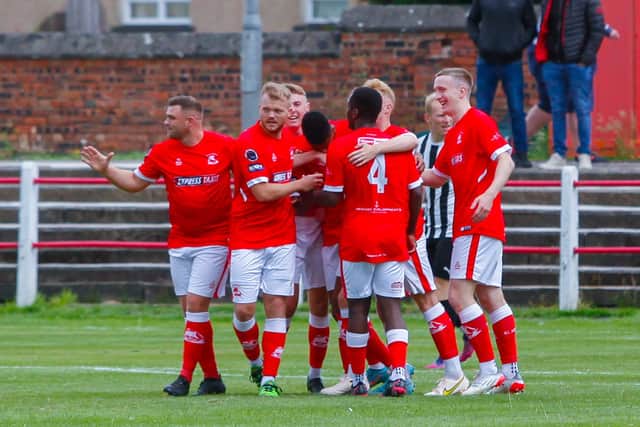 Camelon celebrate Joe Bevan's (middle) strike that opened the scoring for the hosts against local rivals Dunipace (Pics: Michael Gillen)