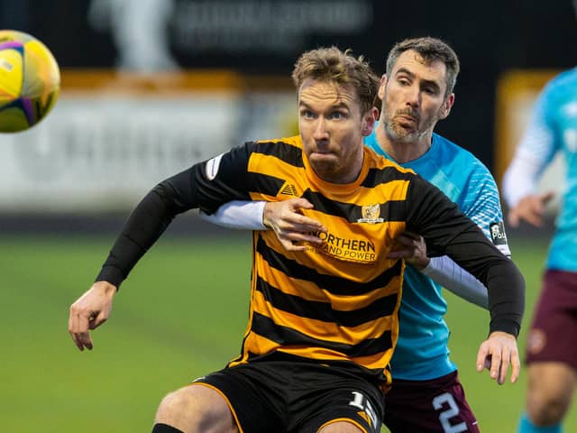 New Stenhousemuir signing Robert Thomson holding off Michael Smith during a Scottish Championship match between Alloa Athletic and Heart of Midlothian in January 2021 (Photo by Bruce White/SNS Group)