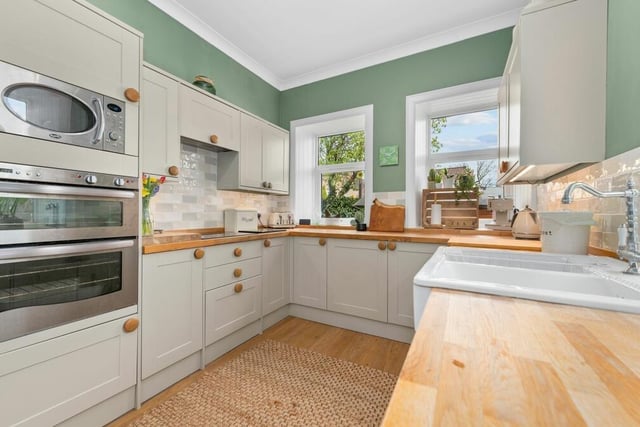 Current owners have used a beautiful colour palette in their home, with a calming green adding more warmth to this fabulous kitchen.