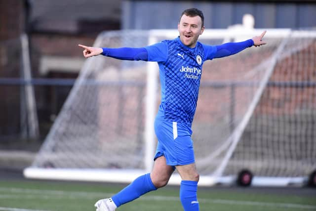 Tom Grant celebrates scoring for BU (Photo: Alan Murray)